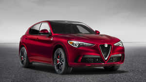 Stunning Alfa Romeo Stelvio On A Scenic Road Wallpaper