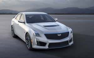 Stunning And Sleek Cadillac Cts In A Scenic Outdoor Setting Wallpaper