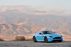 Stunning Aston Martin V12 Vantage Posing On A Race Track Wallpaper