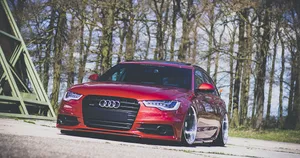 Stunning Audi A4 On Scenic Road Wallpaper