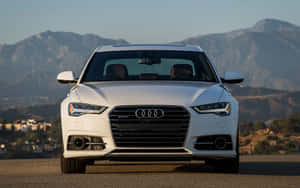 Stunning Audi A6 In Motion On Open Road Wallpaper