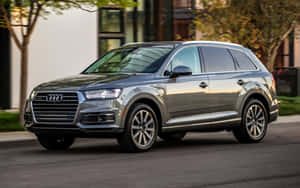 Stunning Audi Q7 On A Scenic Highway Wallpaper