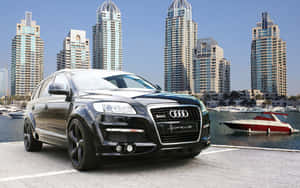 Stunning Audi Q7 On Pristine Scenic Road Wallpaper