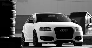 Stunning Audi S3 In Motion On A Scenic Road Wallpaper