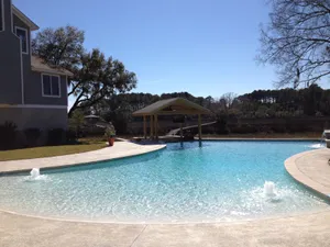 Stunning Beach Swimming Pool Overlooking The Ocean Wallpaper
