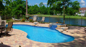 Stunning Beach Swimming Pool With Crystal Clear Water Wallpaper