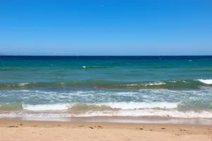 Stunning Beach Waves At Sunset Wallpaper