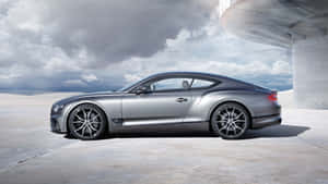 Stunning Bentley Continental Gt In A Picturesque Scenic View Wallpaper