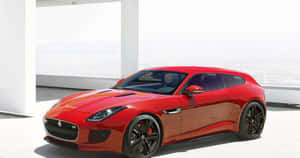 Stunning Blue Hatchback On A Picturesque Drive Wallpaper