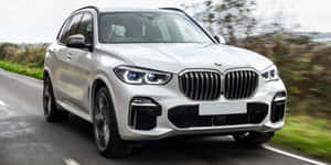 Stunning Bmw X5 On The Road Wallpaper