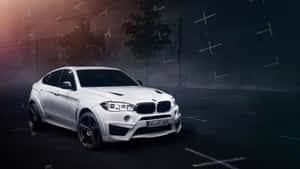 Stunning Bmw X6 Cruising On An Open Road Wallpaper