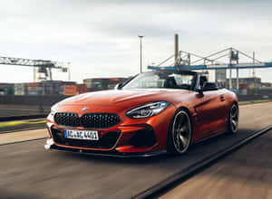 Stunning Bmw Z4 Car On Road Wallpaper