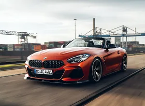 Stunning Bmw Z4 Car On Road Wallpaper