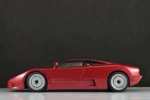 Stunning Bugatti Eb110 In Motion On A Scenic Road Wallpaper