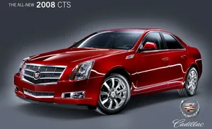 Stunning Cadillac Cts In A Modern City Landscape Wallpaper