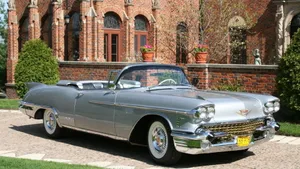 Stunning Cadillac Eldorado In Vibrant City Wallpaper