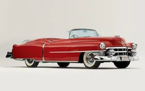 Stunning Cadillac Eldorado Under A Vibrant Sunset Wallpaper