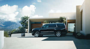 Stunning Cadillac Escalade In A Luxurious Environment Wallpaper