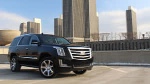 Stunning Cadillac Escalade On City Road Wallpaper