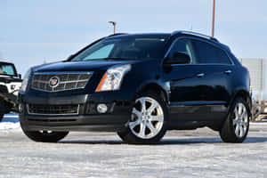 Stunning Cadillac Srx On Scenic Road Wallpaper