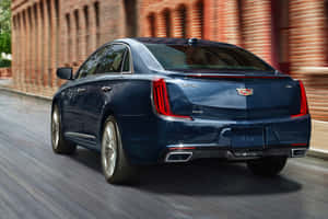 Stunning Cadillac Xts In Vibrant Sunset Wallpaper