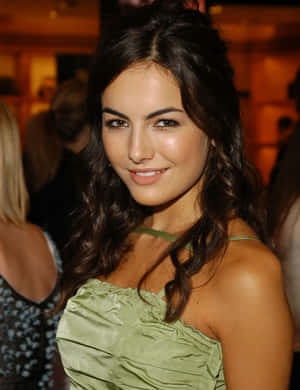 Stunning Camilla Belle In A Red Dress Wallpaper