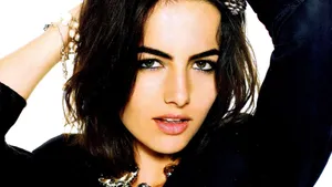 Stunning Camilla Belle Posing In A Stylish Outfit Wallpaper