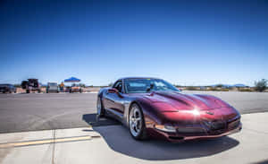 Stunning Chevrolet Corvette C5 In Dynamic Action Wallpaper