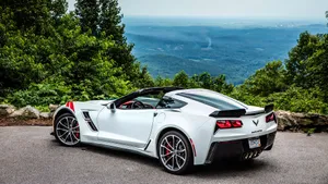 Stunning Chevrolet Corvette Grand Sport Cruising Down The Road Wallpaper