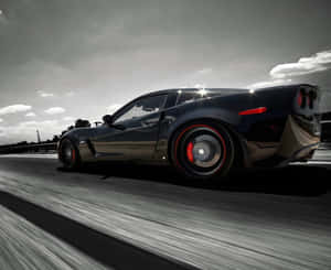 Stunning Chevrolet Corvette Z06 On The Road Wallpaper