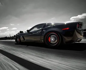 Stunning Chevrolet Corvette Z06 On The Road Wallpaper