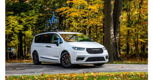 Stunning Chrysler Pacifica On A Scenic Road Wallpaper