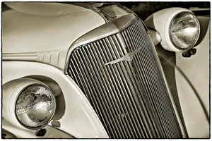 Stunning Close-up Of A Luxury Car Grill Wallpaper