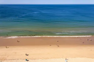 Stunning Coast Of Portuguese Beach During Sunset Wallpaper
