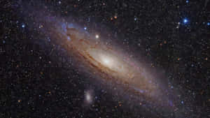 Stunning Elliptical Galaxy In The Depths Of Space Wallpaper