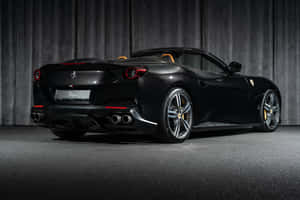 Stunning Ferrari Portofino Cruising Along A Scenic Coastal Road Wallpaper