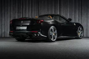 Stunning Ferrari Portofino Cruising Along A Scenic Coastal Road Wallpaper