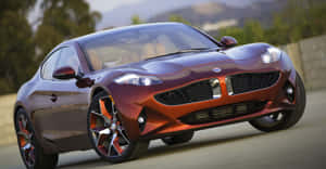 Stunning Fisker Electric Vehicle With A Beautiful Sunset Backdrop Wallpaper