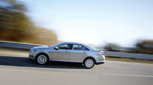 Stunning Ford Taurus In Motion Wallpaper