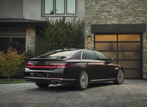 Stunning Genesis G90 Luxury Sedan On The Road Wallpaper