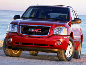 Stunning Gmc Envoy Suv On The Road Wallpaper