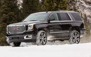 Stunning Gmc Yukon On A Scenic Road Wallpaper