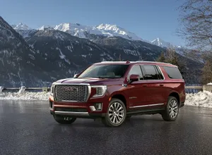 Stunning Gmc Yukon Showcasing Its Stylish Design On The Open Road. Wallpaper