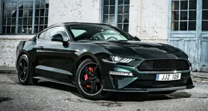 Stunning Green Ford Mustang Bullitt On The Open Road Wallpaper