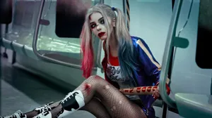Stunning Harley Quinn Cosplay With Iconic Red And Blue Costume Wallpaper