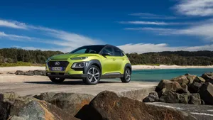 Stunning Hyundai Kona On A Scenic Road Trip Wallpaper
