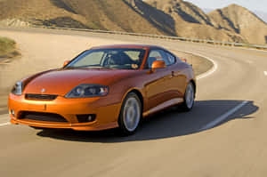 Stunning Hyundai Tiburon Sports Coupe In Action Wallpaper