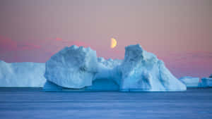 Stunning Iceberg Floating In Crystal Clear Waters Wallpaper