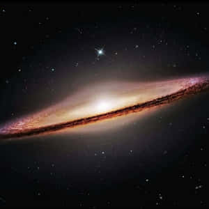 Stunning Image Of The Sombrero Galaxy In The Night Sky Wallpaper