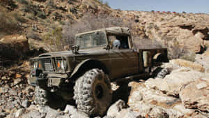 Stunning Jeep Gladiator Conquering Rough Terrain Wallpaper